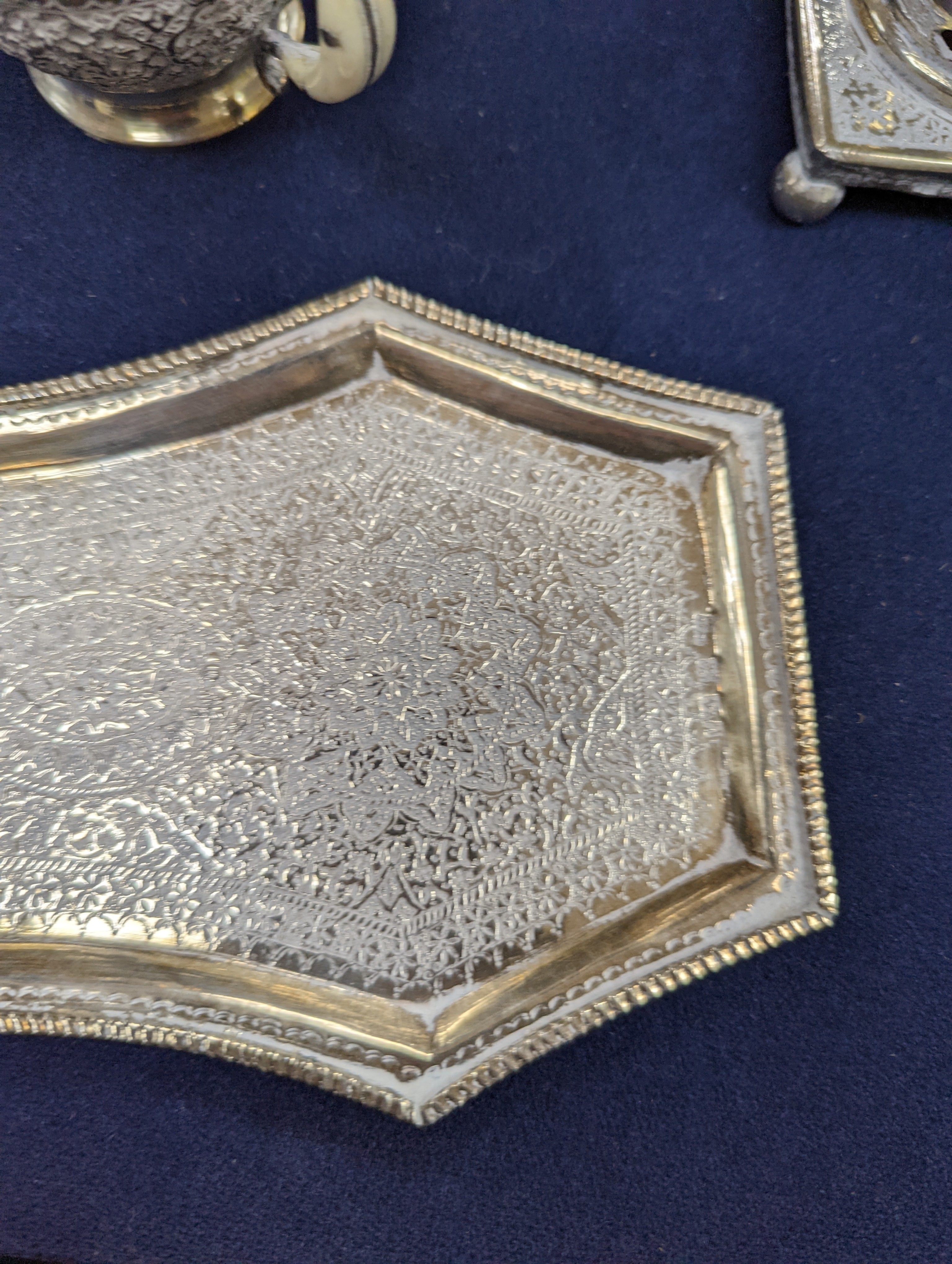 A set of six Persian embossed 84 standard white metal coffee cup holders and matching sugar bowl and cover by Vartan and four other Persian white metal items.